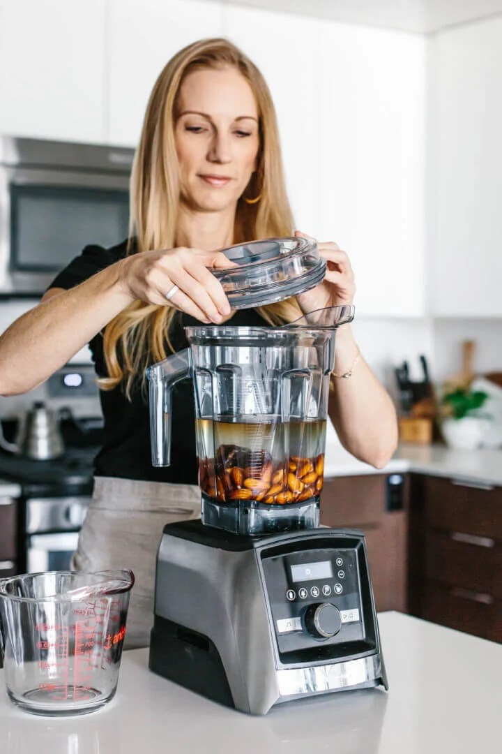 Blending almond milk ingredients in a blender