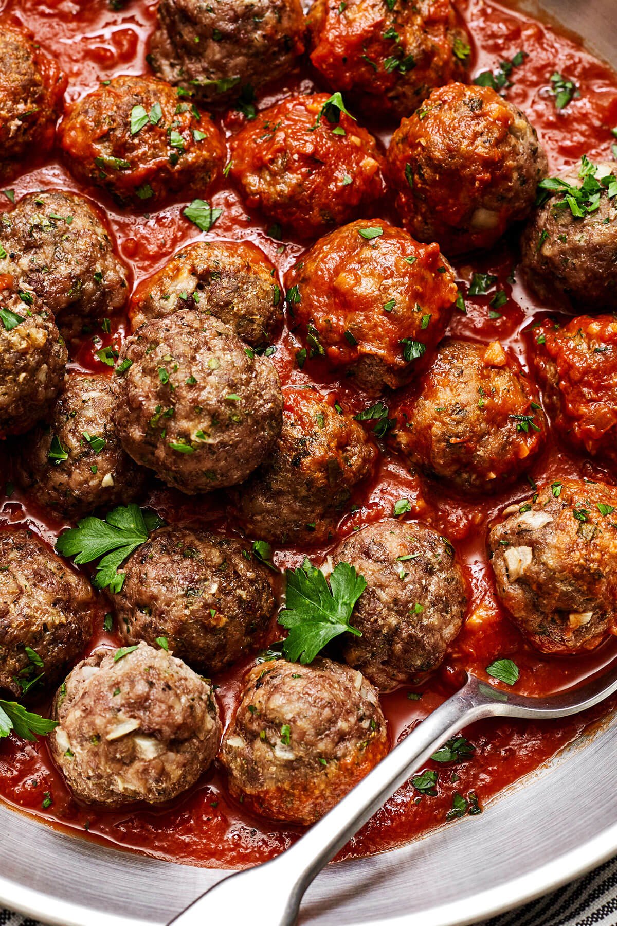 Close up of meatballs in marinara sauce
